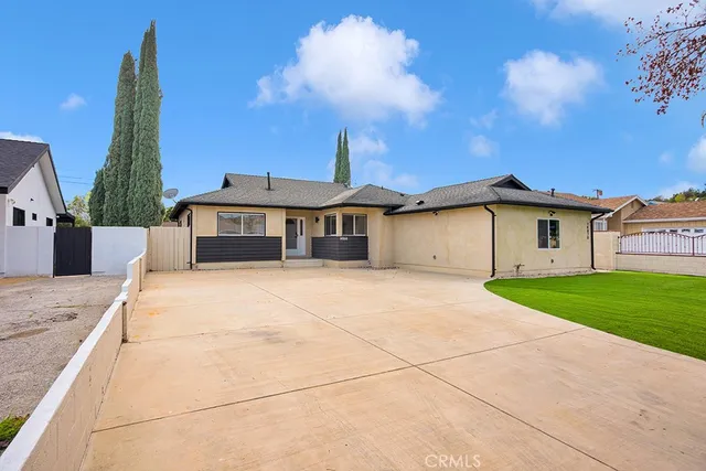 aerial view of a house with a yard