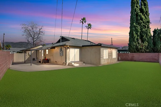 an aerial view of a house with a swimming pool