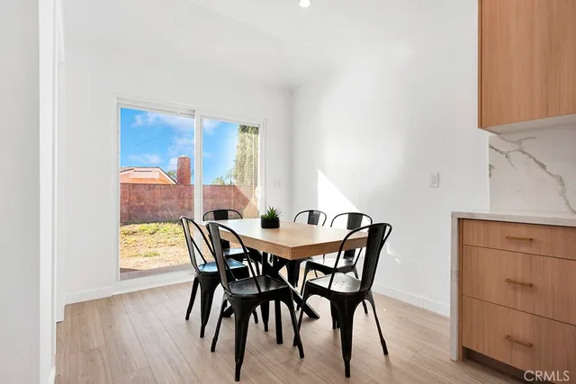 a kitchen with a table and chairs