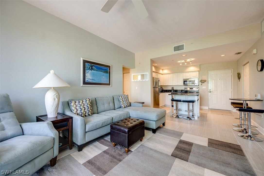 2060 Matecumbe Key Road, Unit 2207 Punta Gorda, FL 33955 - Photo 4 of 21 a living room with furniture and a table