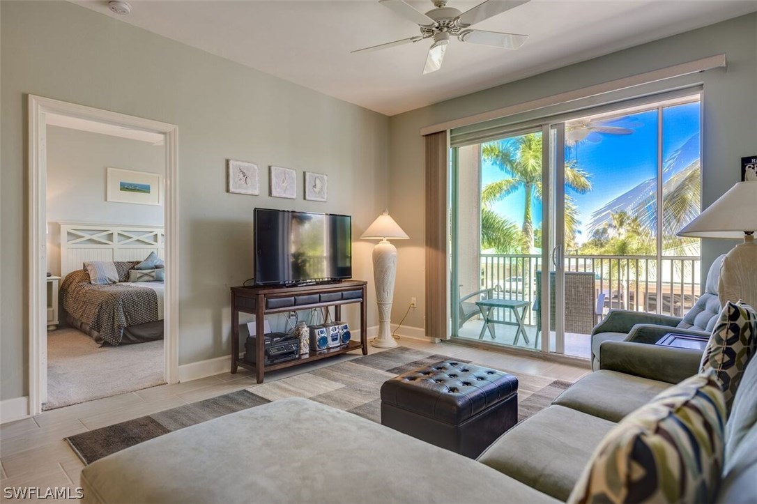 2060 Matecumbe Key Road, Unit 2207 Punta Gorda, FL 33955 - Photo 5 of 21 a living room with furniture and a flat screen tv