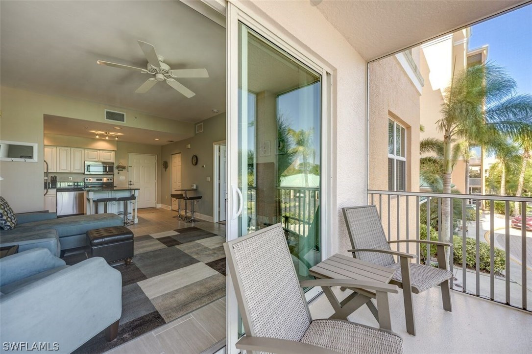 2060 Matecumbe Key Road, Unit 2207 Punta Gorda, FL 33955 - Photo 6 of 21 a living room with furniture and a large window