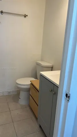 a bathroom with a sink and toilet