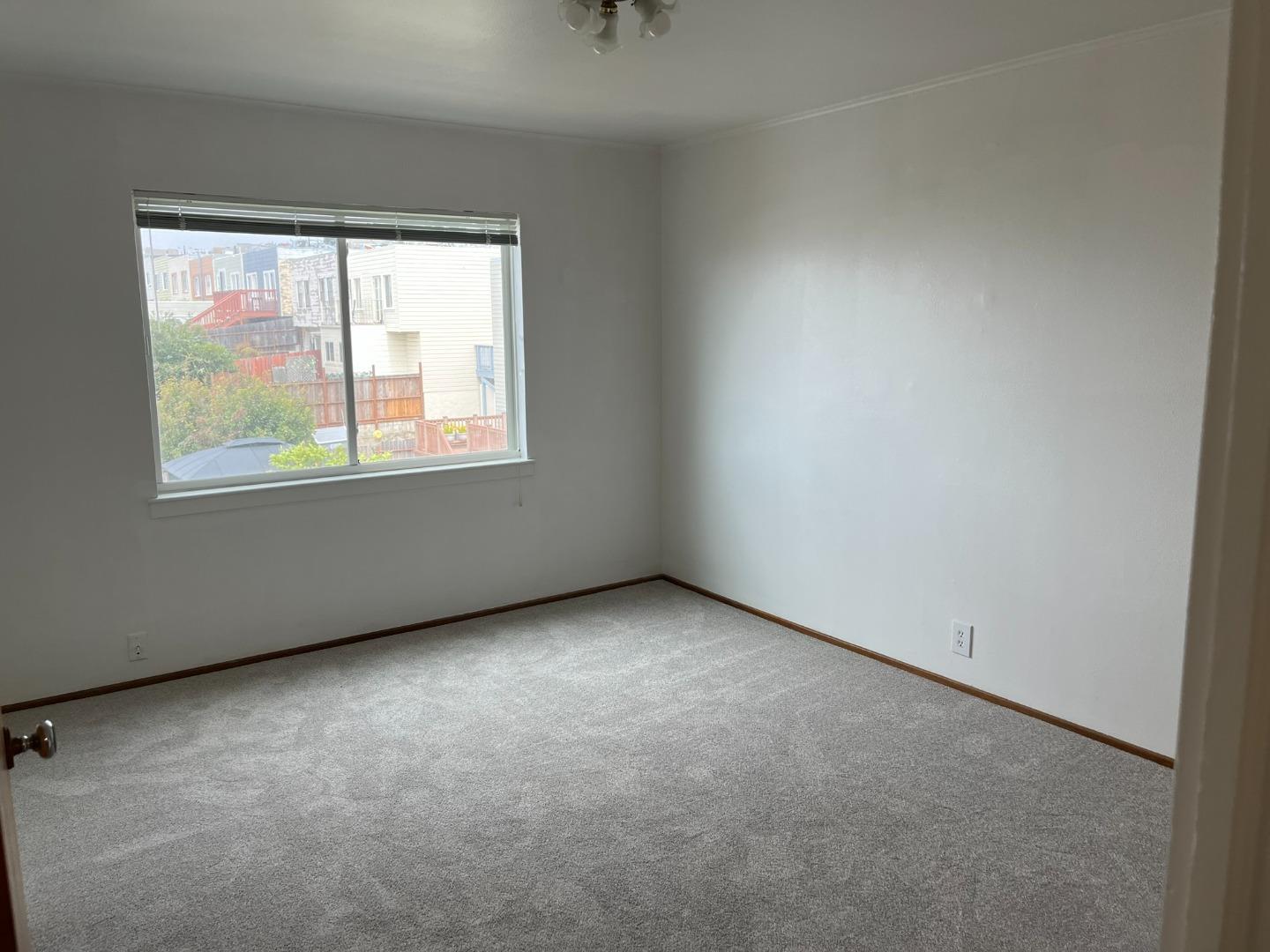 2028-2030 Taraval Street San Francisco, CA 94116 - Photo 12 of 18 an empty room with a window