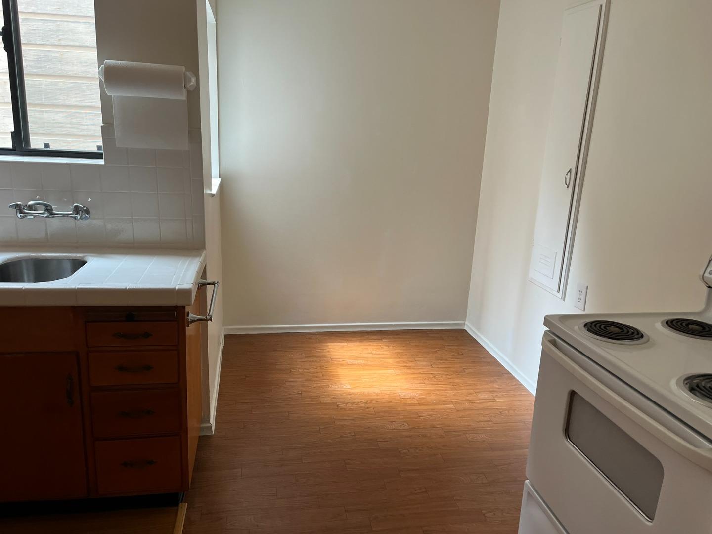 2028-2030 Taraval Street San Francisco, CA 94116 - Photo 15 of 18 a kitchen that has a sink and a stove in it
