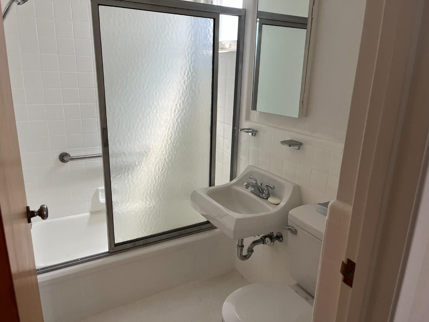 2028-2030 Taraval Street San Francisco, CA 94116 - Photo 6 of 18 a bathroom with a sink toilet and shower