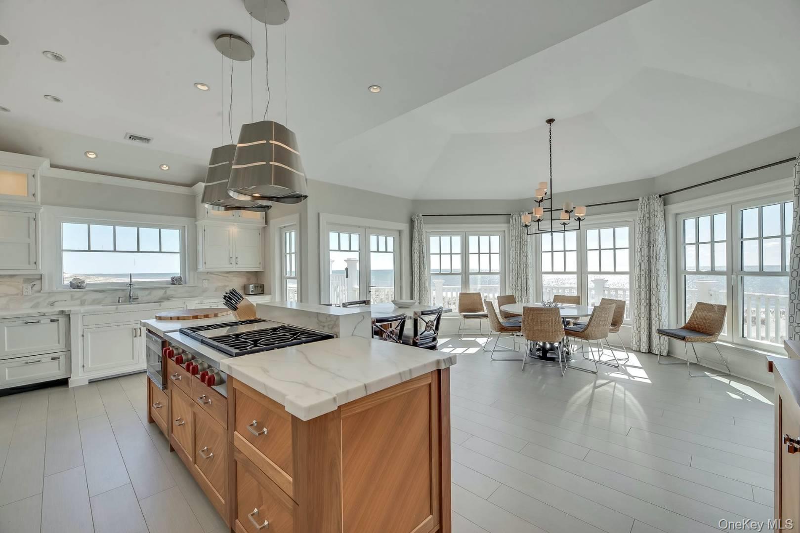 19 Dune Road East Quogue, NY 11959 - Photo 11 of 19 a kitchen that has a lot of cabinets