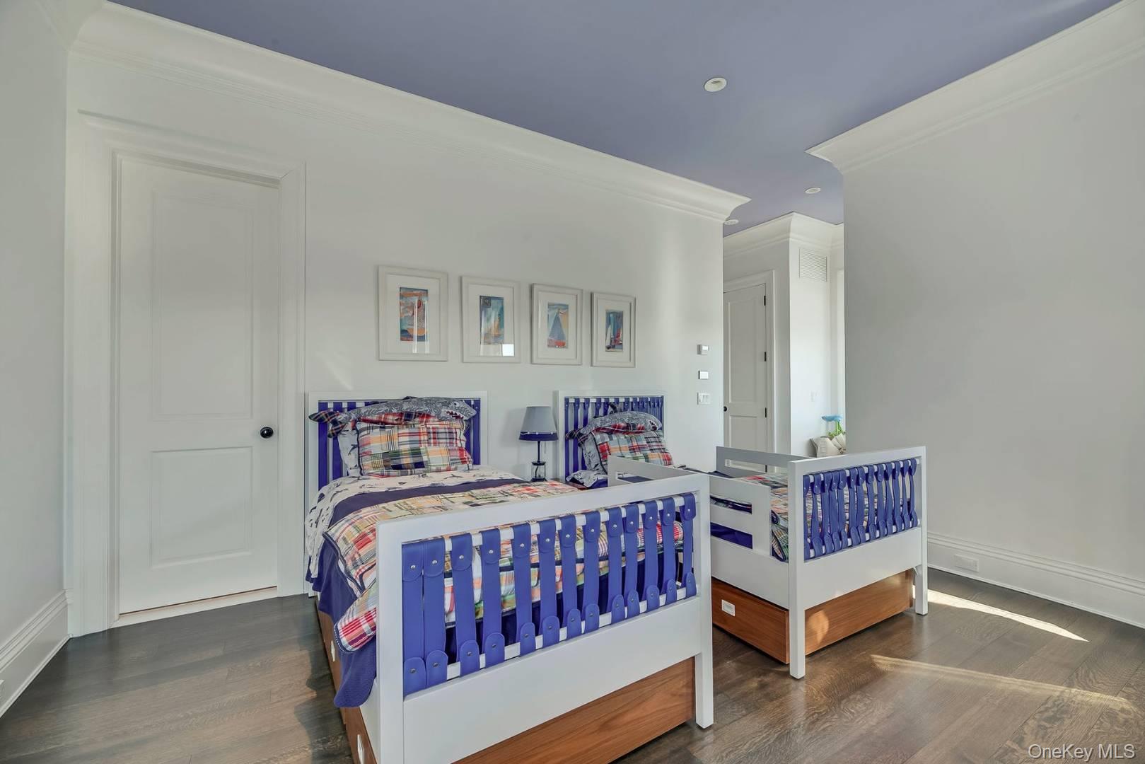 19 Dune Road East Quogue, NY 11959 - Photo 15 of 19 a bedroom with a bed and window