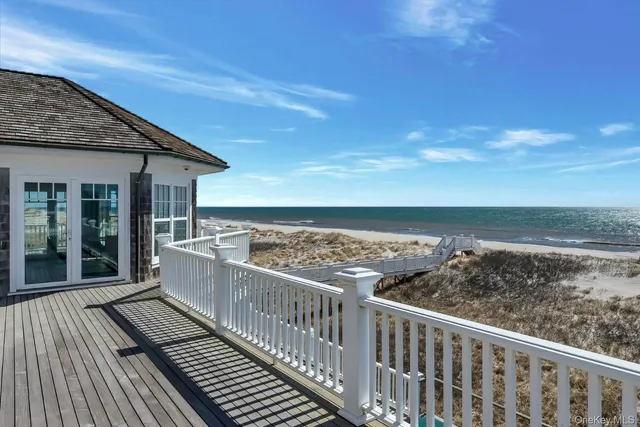 a view of a balcony with wooden floor