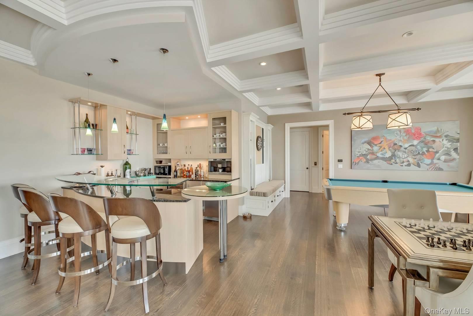 19 Dune Road East Quogue, NY 11959 - Photo 5 of 19 a large kitchen with a table and chairs