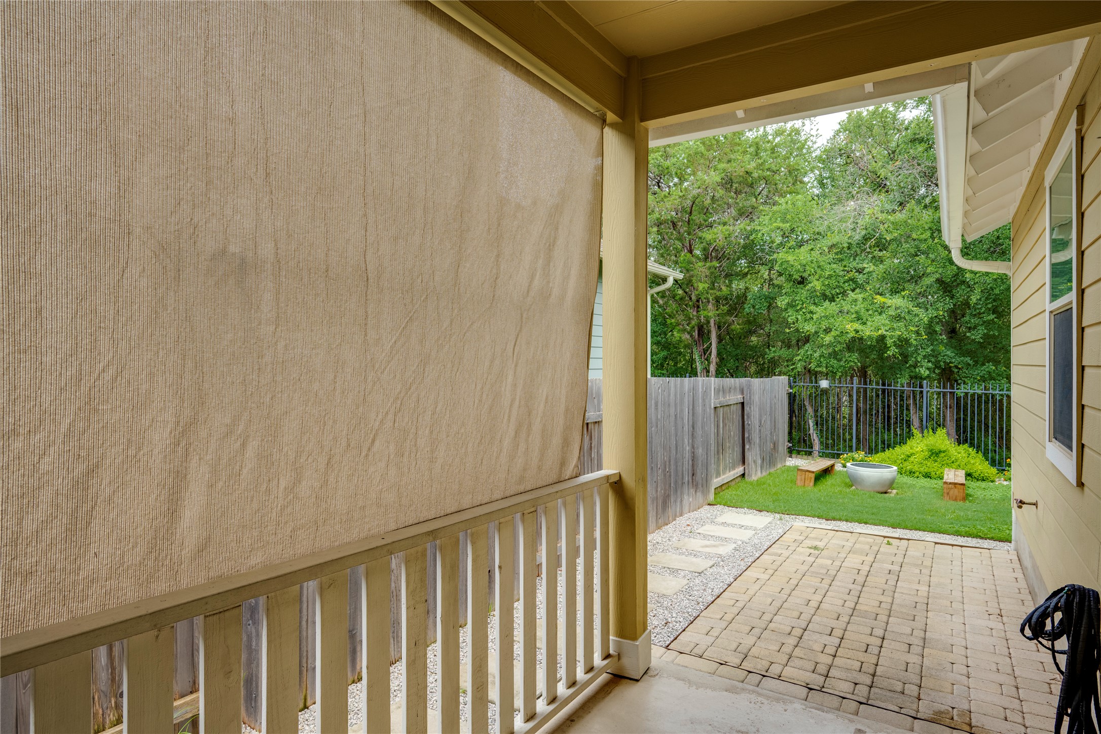 6008 Whipple Way Austin, TX 78745 - Photo 30 of 39 A spacious covered patio provides a serene outdoor retreat, opening to a private yard.