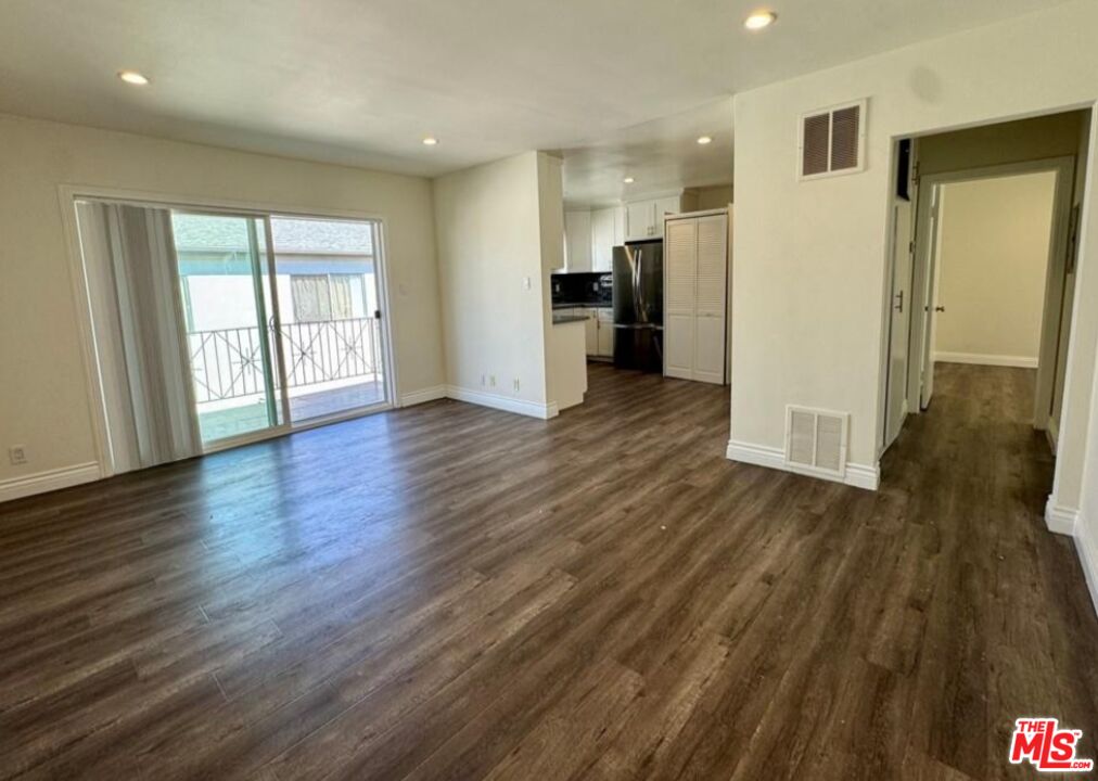 2040 South Sherbourne Drive, Unit 4 Los Angeles, CA 90034 - Photo 10 of 14 a view of empty room with wooden floor