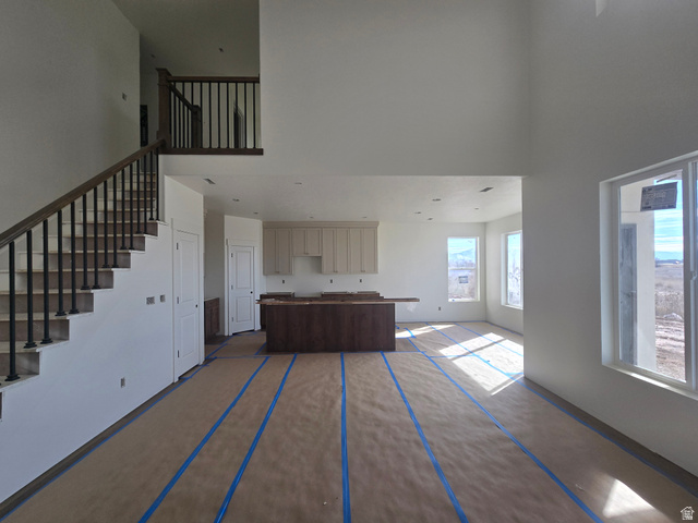 1651 West Ross Road Syracuse, UT 84075 - Photo 8 of 15 Living area with a high ceiling