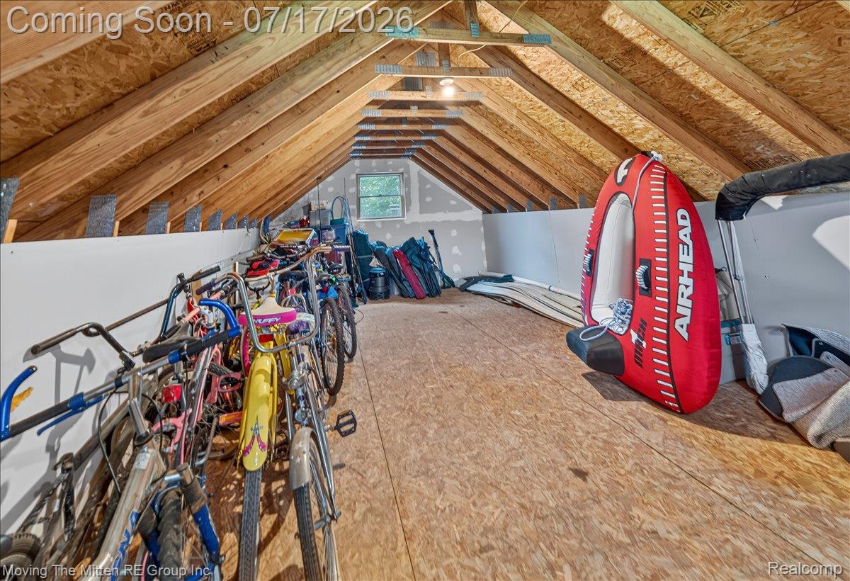 40162 Alden Road Belleville, MI 48111 - Photo 47 of 67 Spacious attic storage area featuring exposed wood beams and oriented strand board flooring