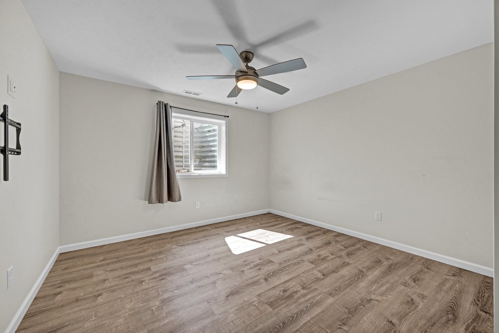 277 Cassidy Road Normal, IL 61761 - Photo 28 of 42 wooden floor in an empty room with a window
