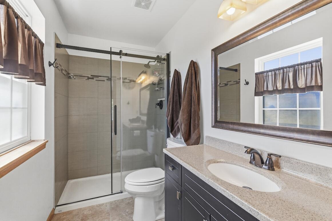 1189 Mockingbird Drive Oconomowoc, WI 53066 - Photo 19 of 31 Primary Updated Bathroom