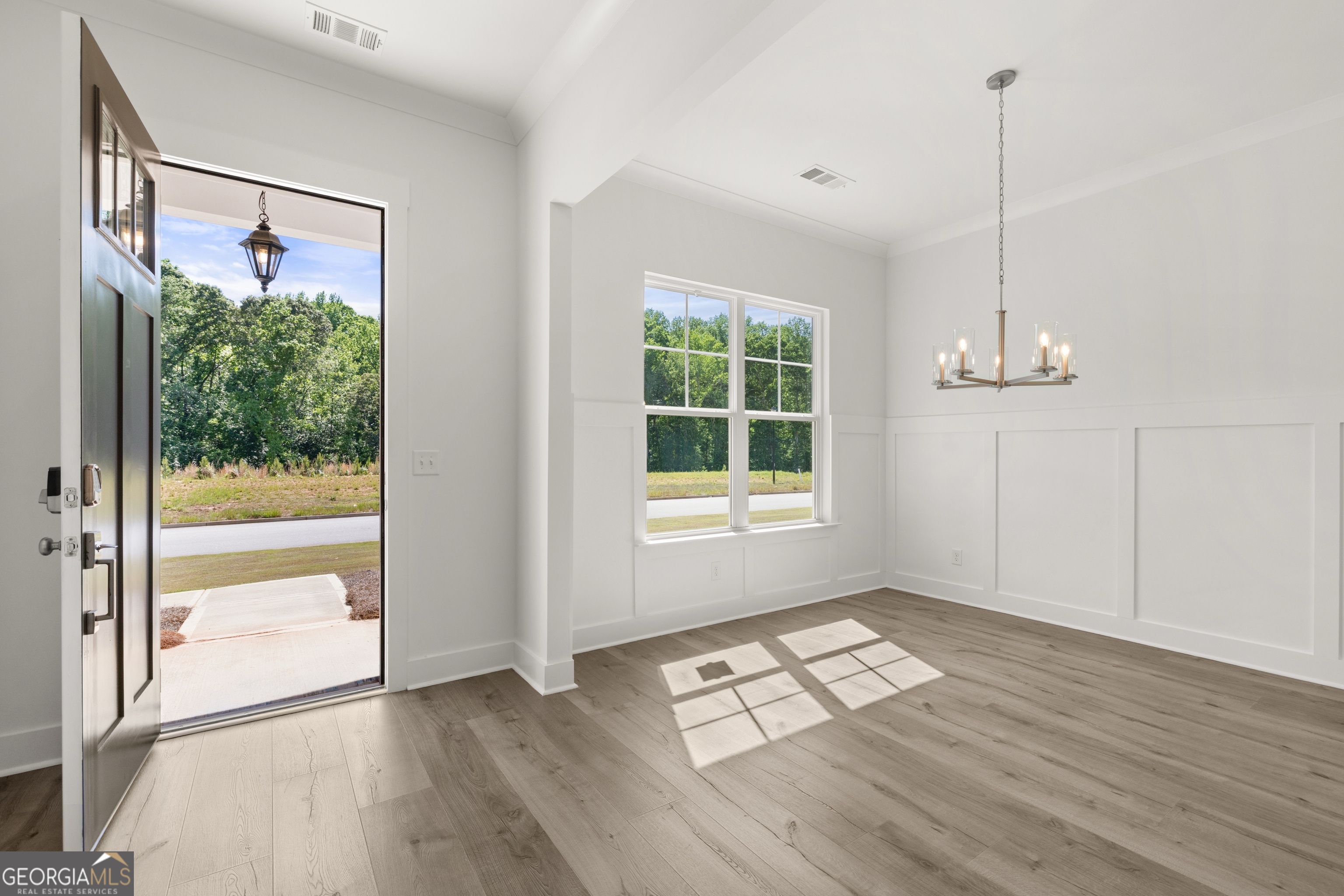 15 Overview Court Hoschton, GA 30548 - Photo 8 of 43 a view of empty room with wooden floor and fan