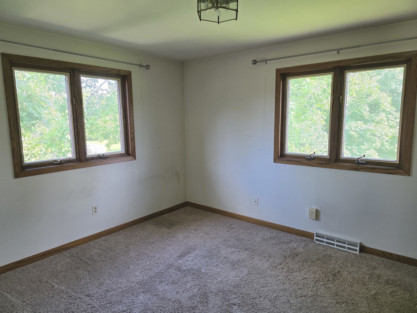 1546 Wheeler Street Woodstock, IL 60098 - Photo 22 of 32 a view of an empty room with a window