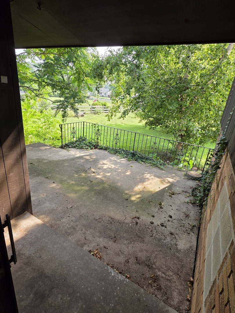 1546 Wheeler Street Woodstock, IL 60098 - Photo 7 of 32 a view of a garden with an outdoor space