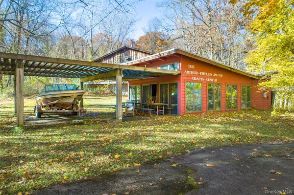 a view of a house with a yard porch and sitting area