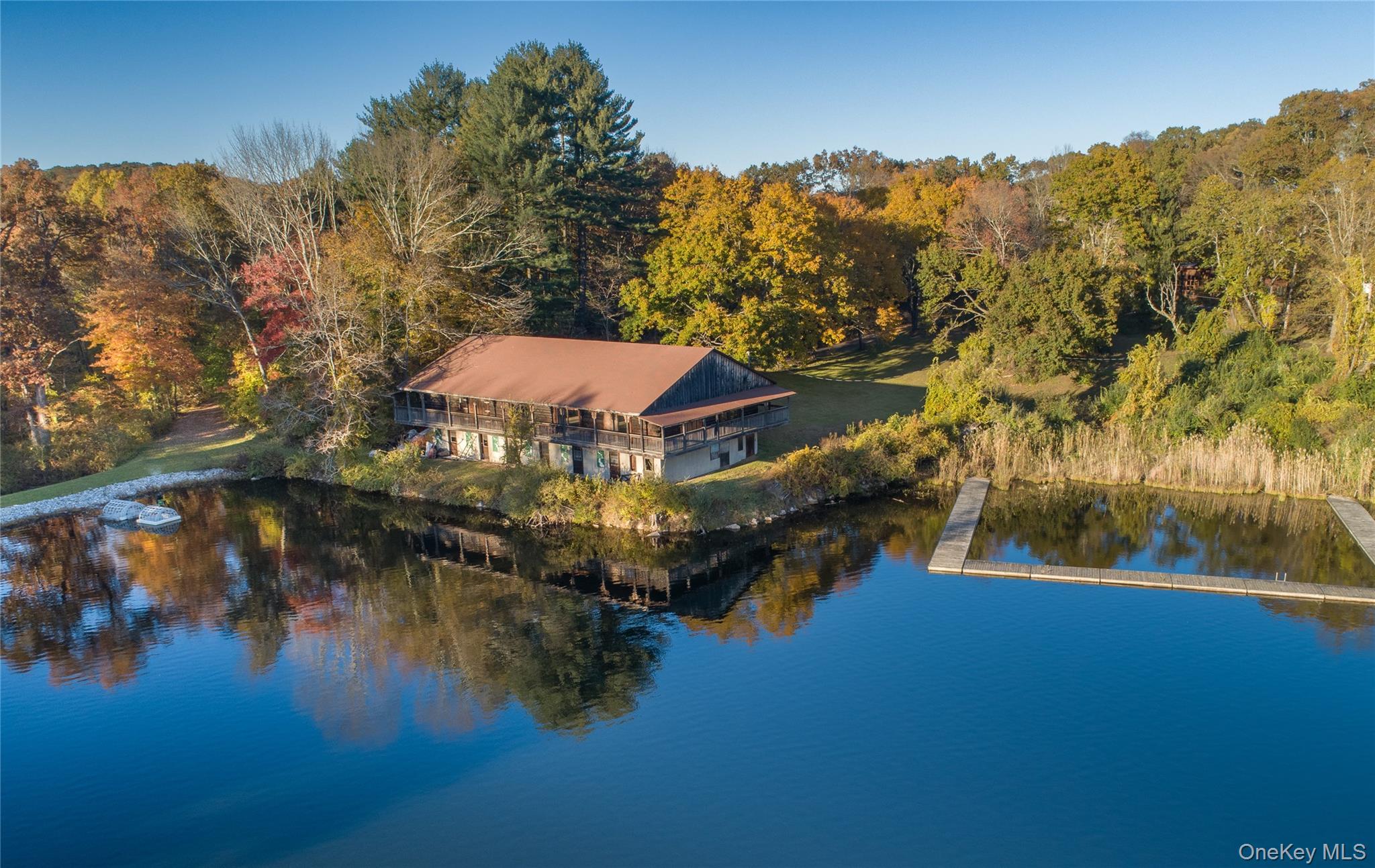 111 Ballyhack Road Brewster, NY 10509 - Photo 3 of 26 a view of a lake with a mountain in the background
