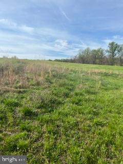 15200 Croom Road Brandywine, MD 20613 - Photo 55 of 71 a view of a field with an ocean and trees