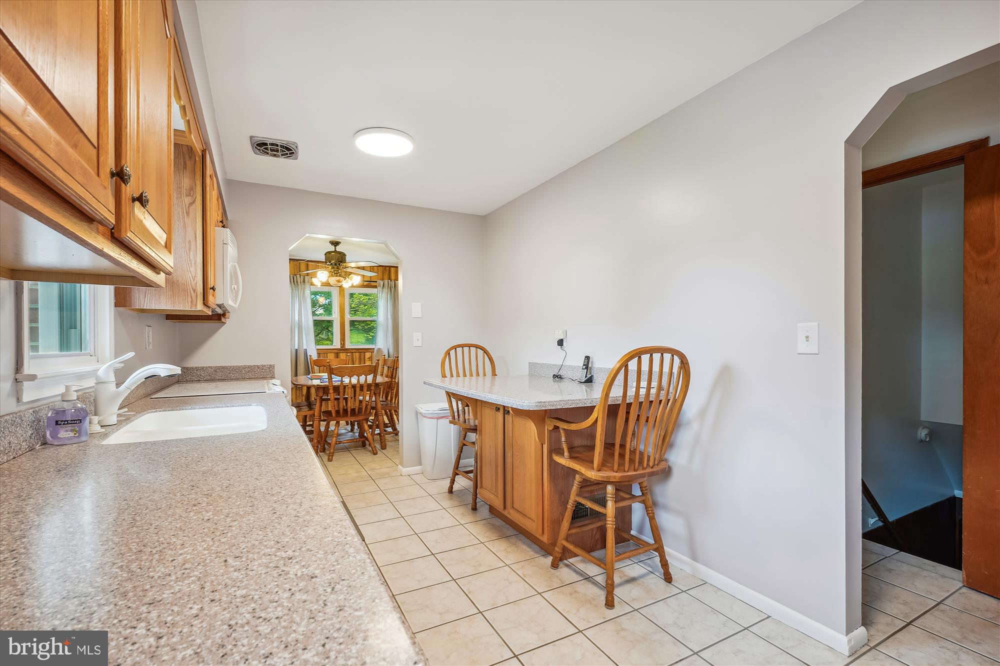 15200 Croom Road Brandywine, MD 20613 - Photo 10 of 71 a view of a dining room with furniture and a chandelier