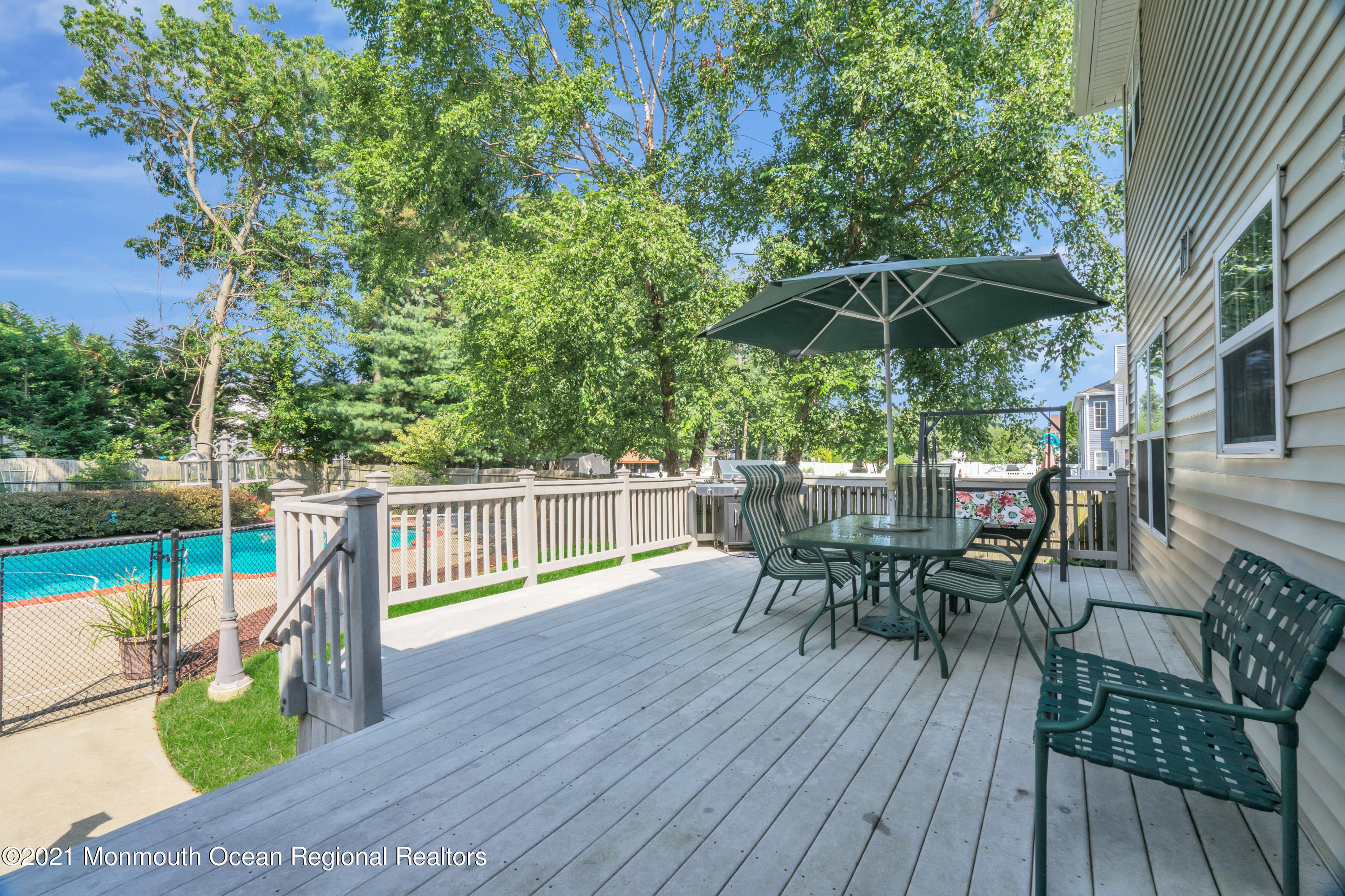 7 Sun Hollow Road Howell, NJ 07731 - Photo 25 of 31 a view of balcony with outdoor seating and wooden floor