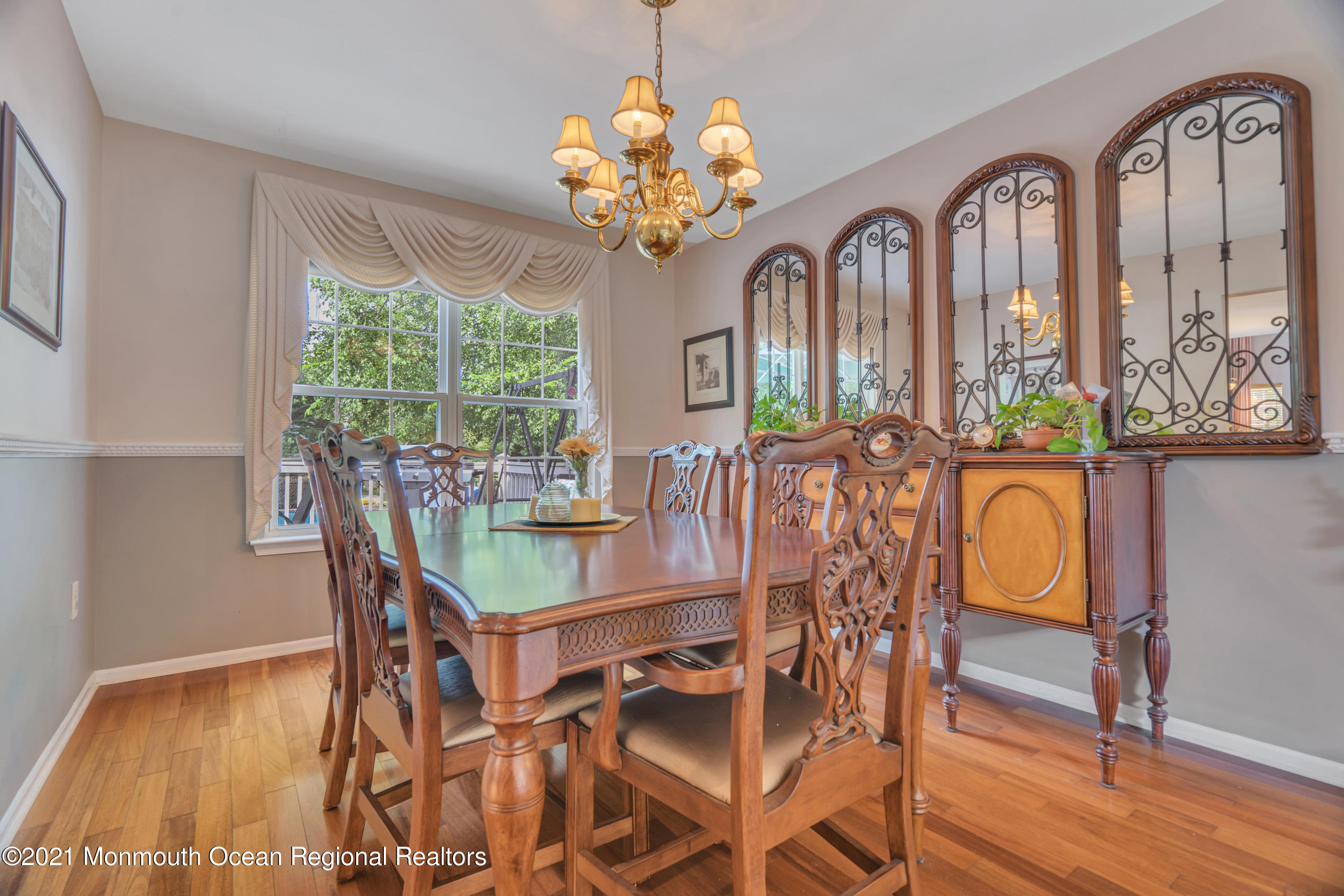 7 Sun Hollow Road Howell, NJ 07731 - Photo 6 of 31 a view of a dining room with furniture a chandelier and wooden floor