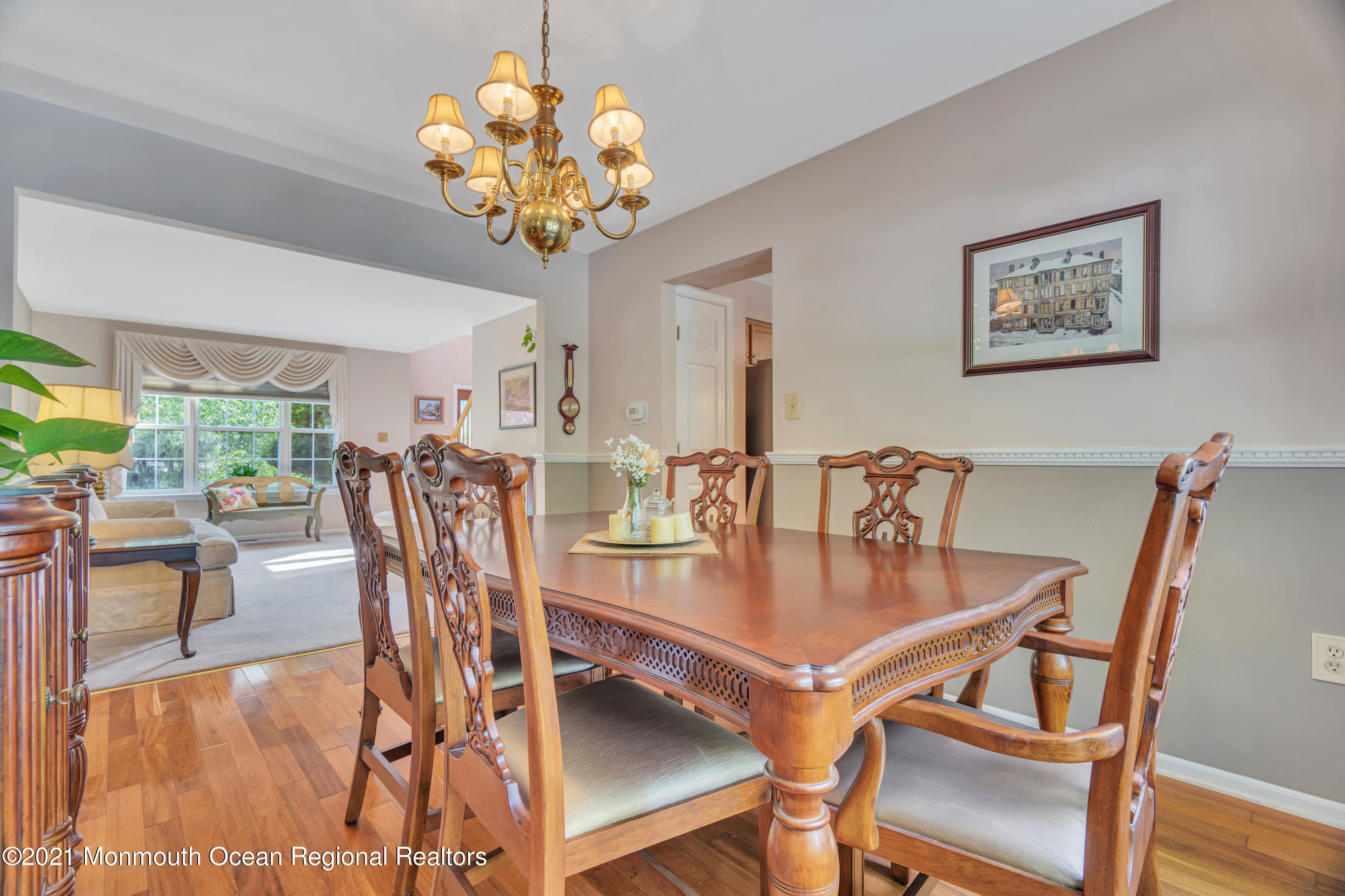 7 Sun Hollow Road Howell, NJ 07731 - Photo 7 of 31 a dining room filled chandelier and wooden floor