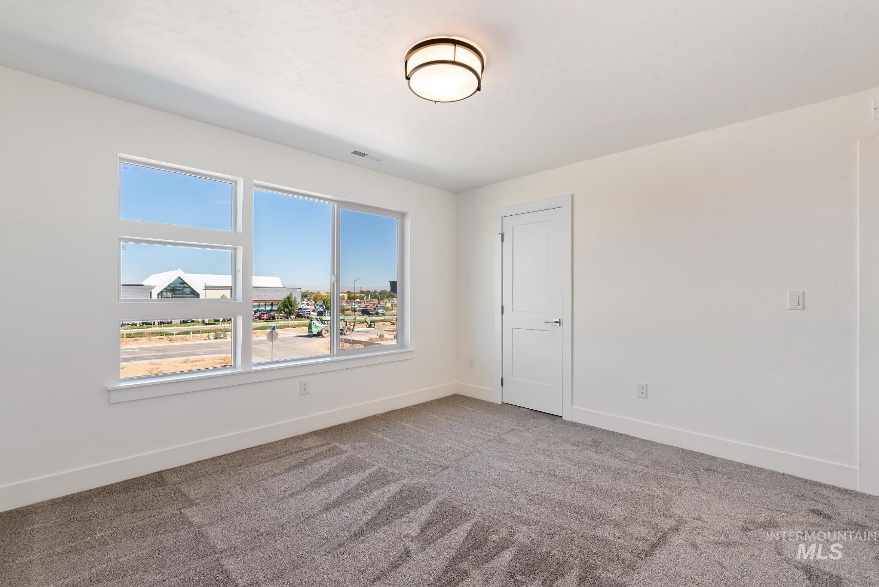 1319 West Malbar Street Meridian, ID 83646 - Photo 18 of 31 Unfurnished room with carpet floors and baseboards