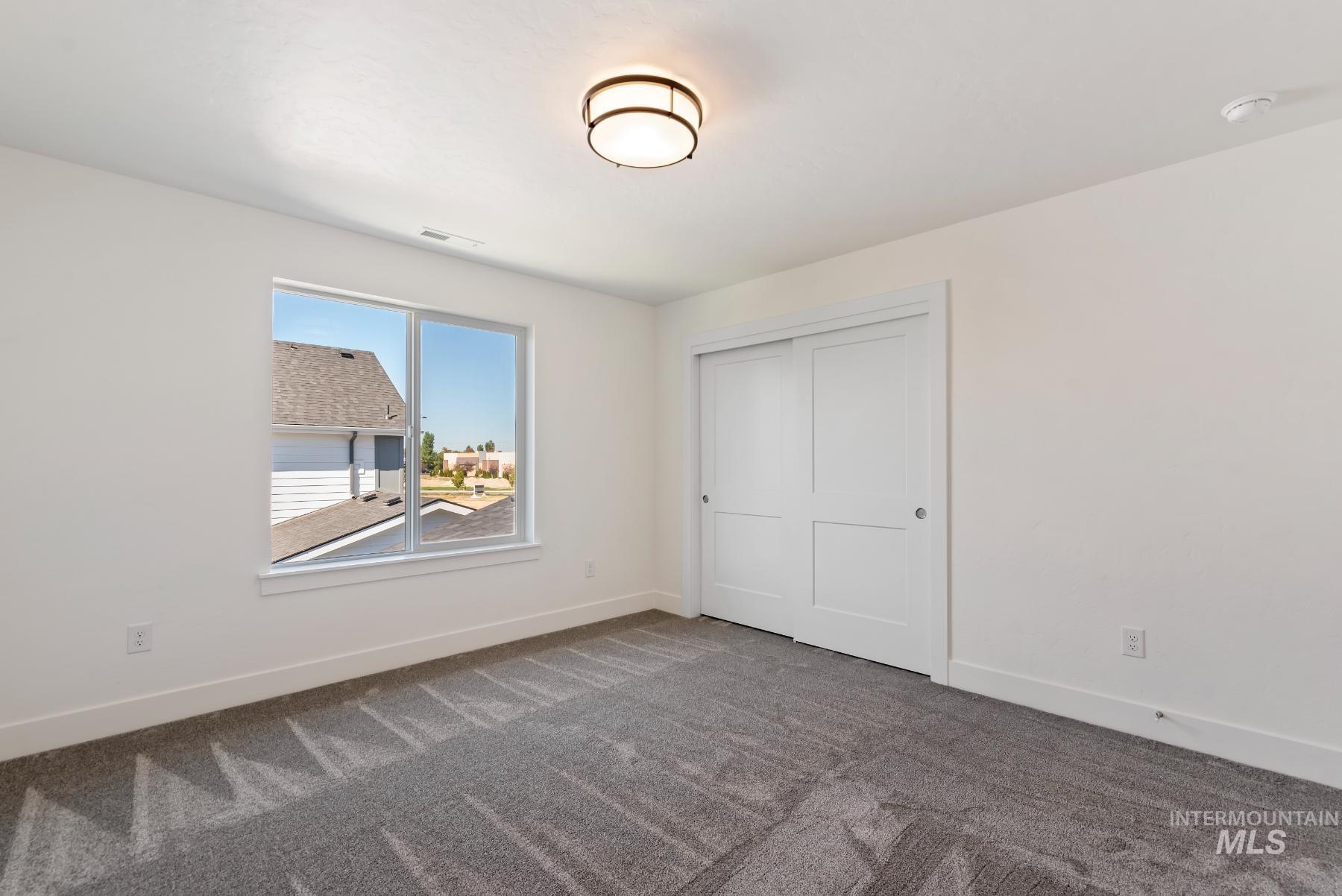 1319 West Malbar Street Meridian, ID 83646 - Photo 19 of 31 Unfurnished bedroom with carpet flooring and a closet