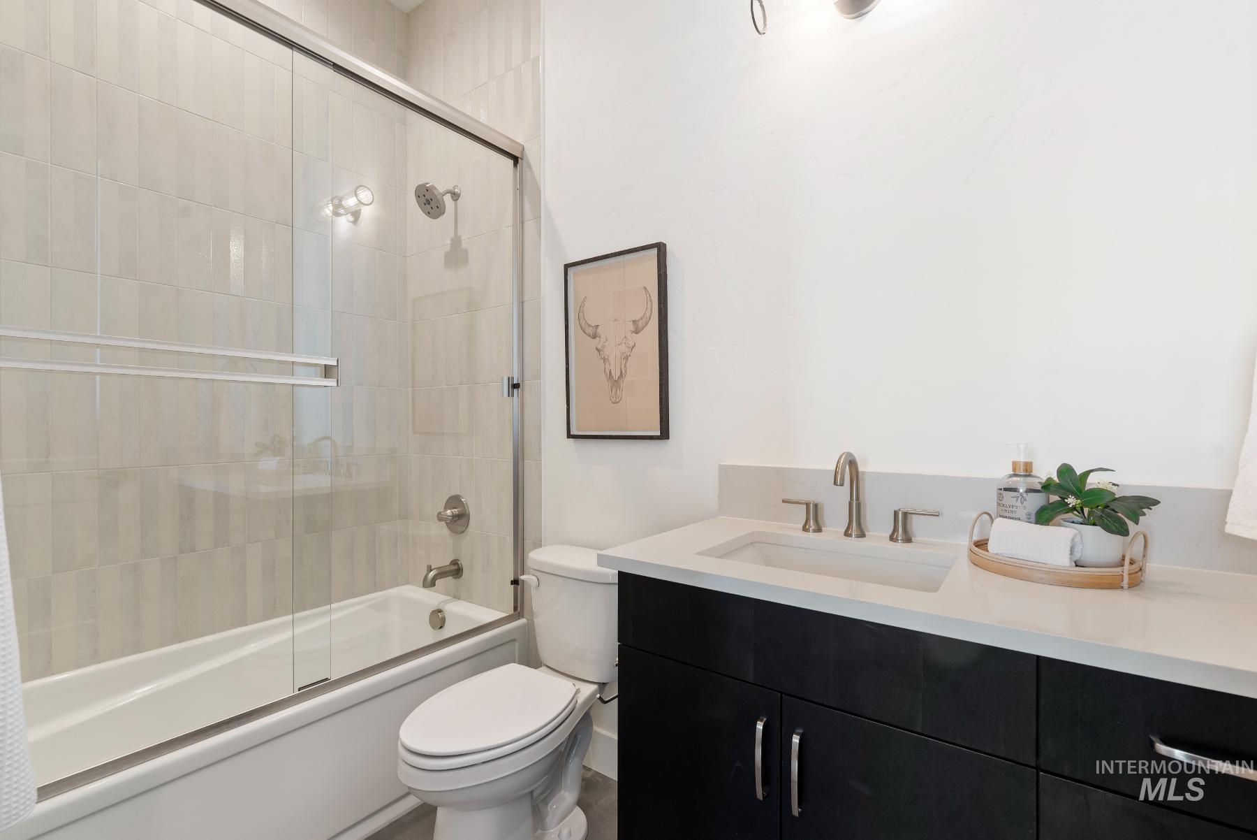 1319 West Malbar Street Meridian, ID 83646 - Photo 23 of 31 Bathroom featuring bath / shower combo with glass door and vanity
