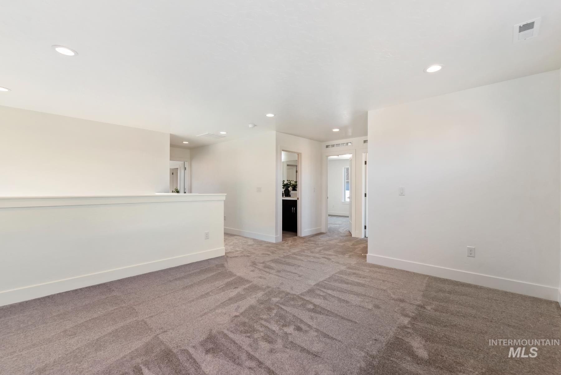 1319 West Malbar Street Meridian, ID 83646 - Photo 28 of 31 Unfurnished room featuring carpet flooring and recessed lighting