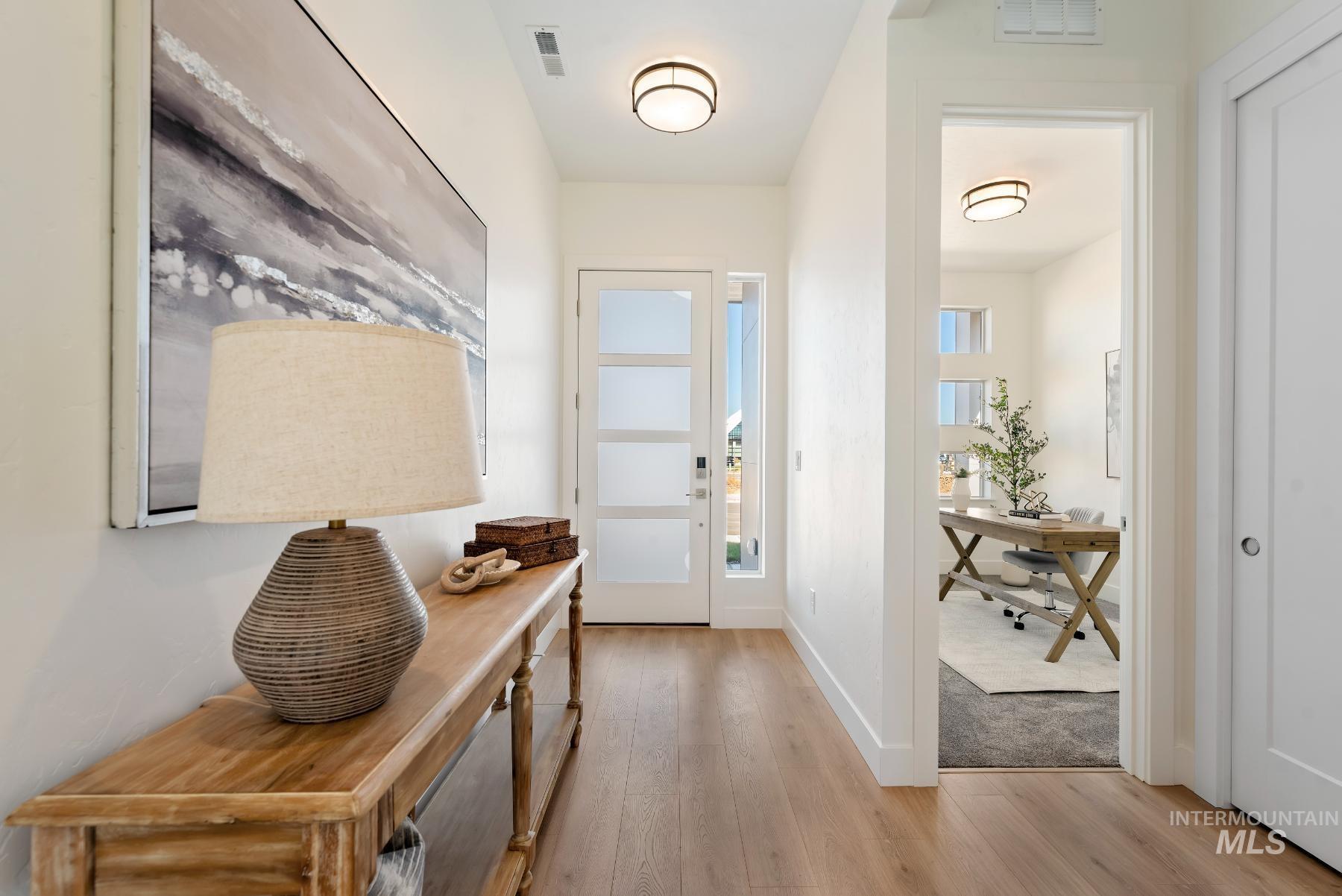 1319 West Malbar Street Meridian, ID 83646 - Photo 3 of 31 Entryway with wood finished floors and a desk