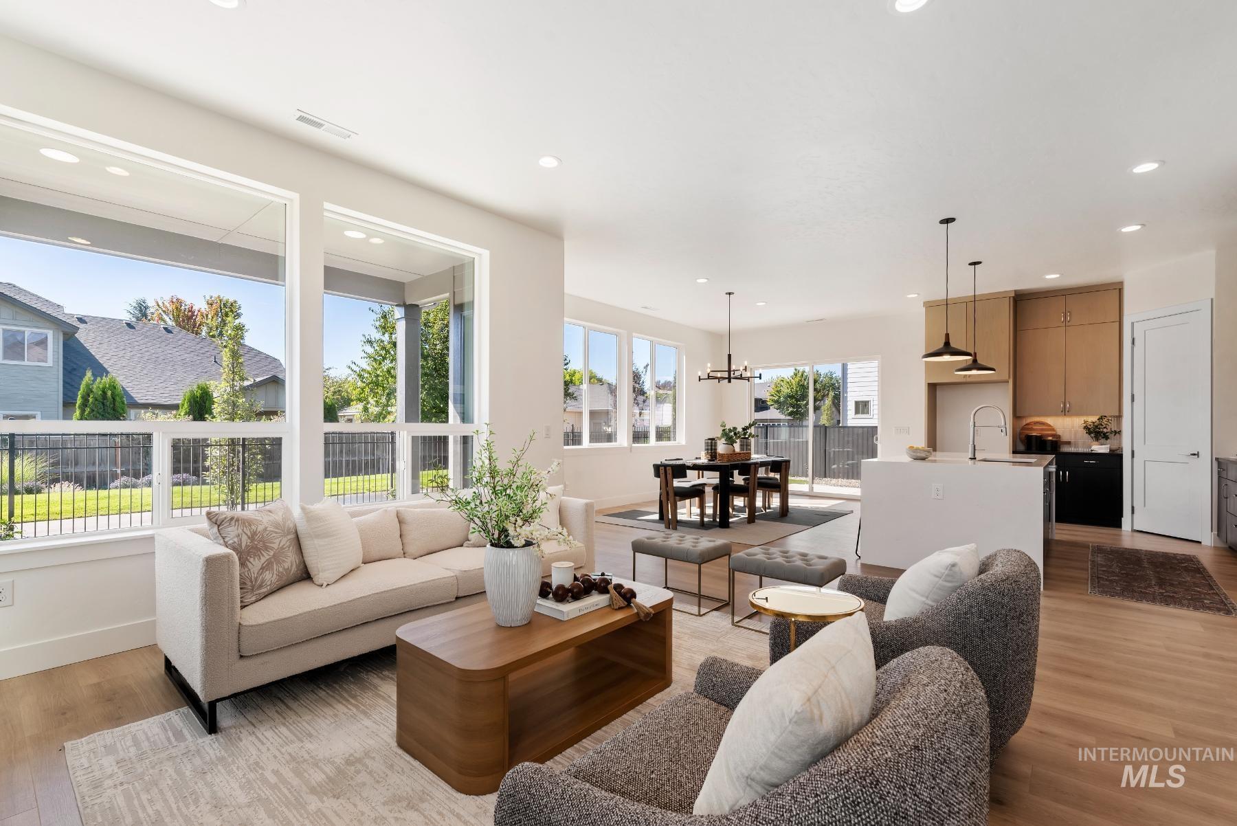 1319 West Malbar Street Meridian, ID 83646 - Photo 7 of 31 Living room with light wood-style floors, recessed lighting, and a chandelier