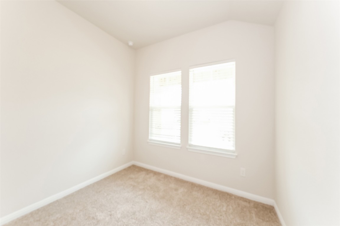 1021 Round Bale Road Hutto, TX 78634 - Photo 13 of 16 an empty room with a window