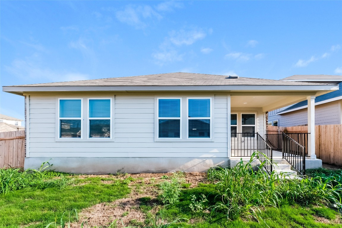 1021 Round Bale Road Hutto, TX 78634 - Photo 15 of 16 front view of a house with a large window