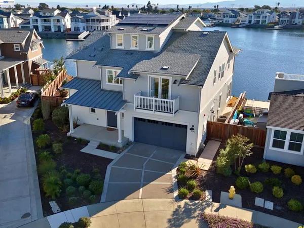an aerial view of multiple houses with yard