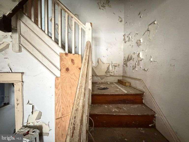 3923 Ridgewood Avenue Baltimore, MD 21215 - Photo 7 of 18 a view of staircase with white walls