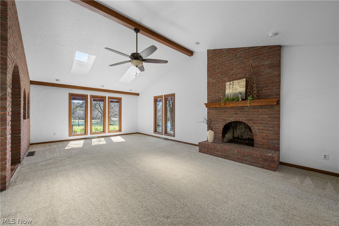 490 Johnson Road Kent, OH 44240 - Photo 12 of 49 A gas fireplace adds warmth and coziness to this spacious room.