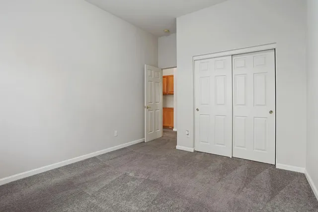 an empty room with closet area