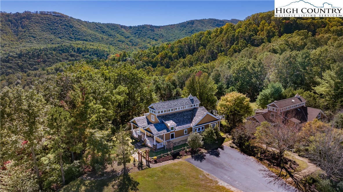195 The Courtyard Boone, NC 28607 - Photo 12 of 16 an aerial view of a house with a yard