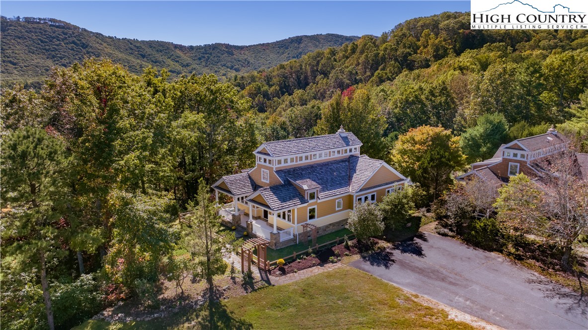 195 The Courtyard Boone, NC 28607 - Photo 13 of 16 an aerial view of a house with a yard