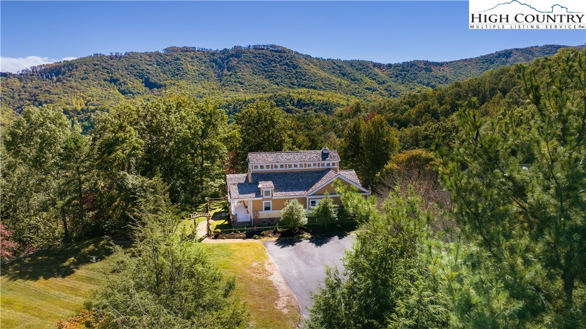 195 The Courtyard Boone, NC 28607 - Photo 15 of 16 an aerial view of a house with mountain view
