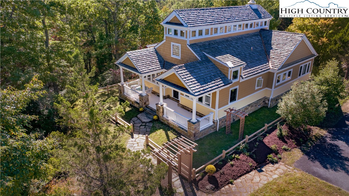 195 The Courtyard Boone, NC 28607 - Photo 16 of 16 a view of a house with roof deck and iron fence