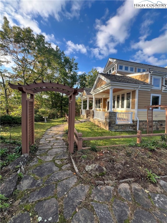 195 The Courtyard Boone, NC 28607 - Photo 6 of 16 a front view of a house with a yard