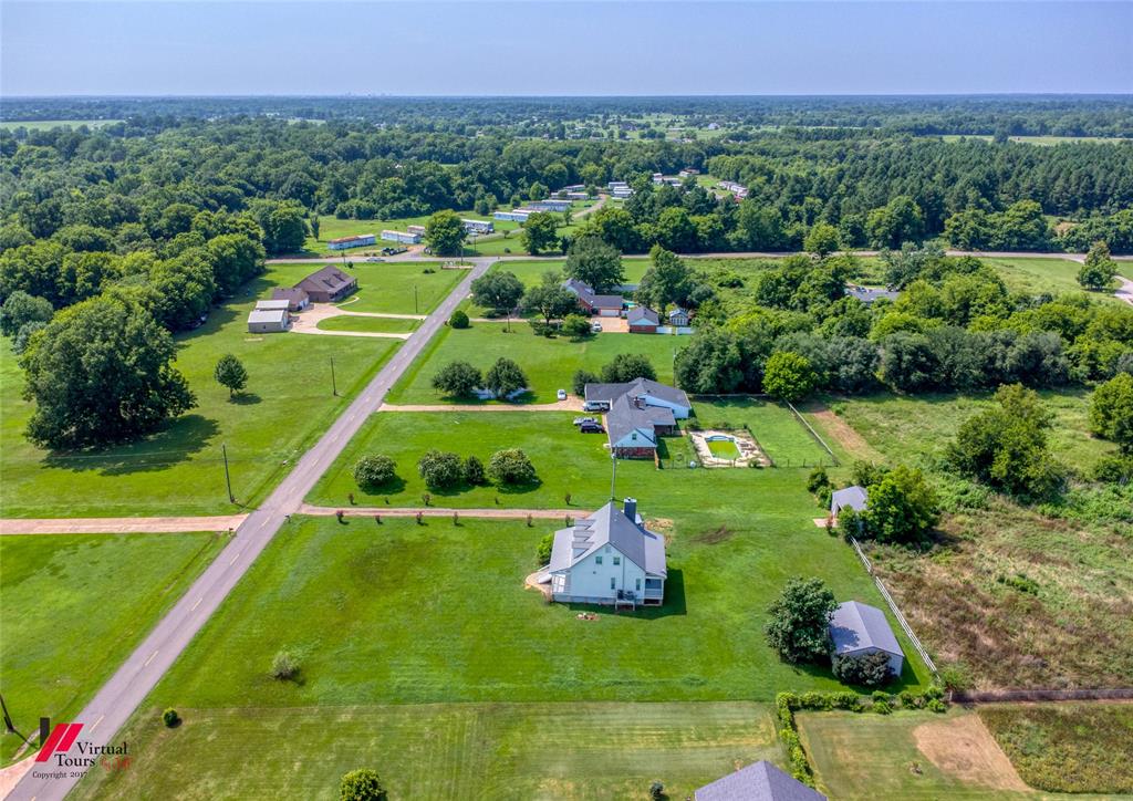 179 Ranchtown Road Elm Grove, LA 71051 - Photo 22 of 26 Aerial perspective showcasing multiple properties amidst expansive green spaces and mature trees