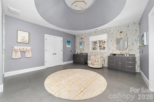 a bathroom with a sink a mirror and shower