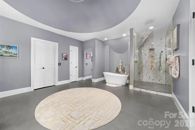 a room with furniture wall paintings and a window